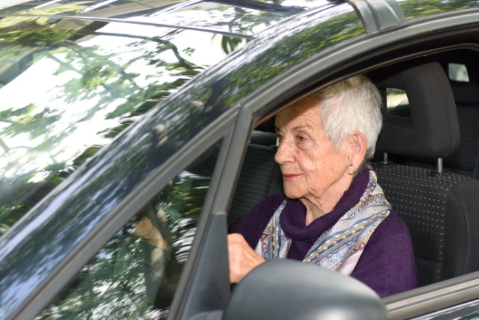Senior female driver focused on the road during an Enhanced Road Assessment (ERA) in British Columbia.